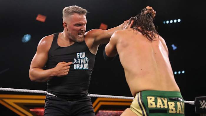 Former NFL punter Pat McAfee participates in a WWE match.